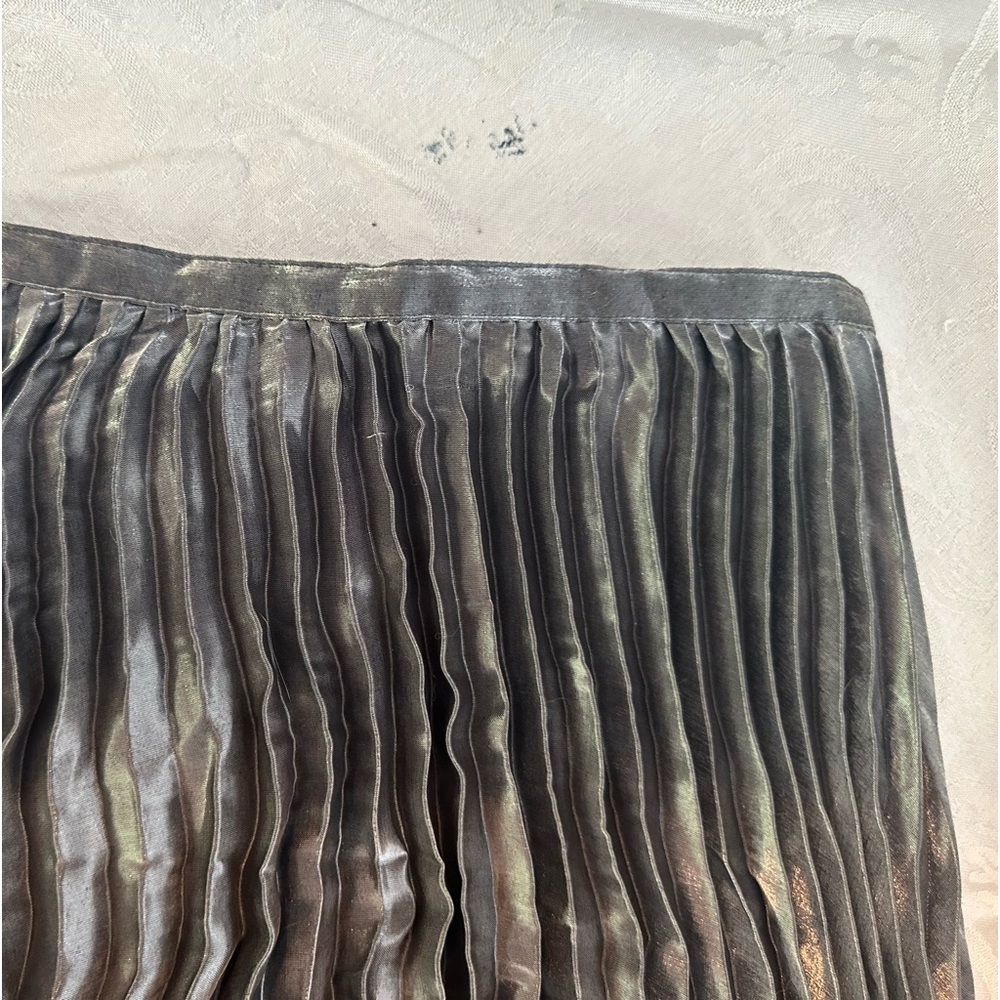 Silver pleated skirt. Dress it up or down! 40” length, size medium